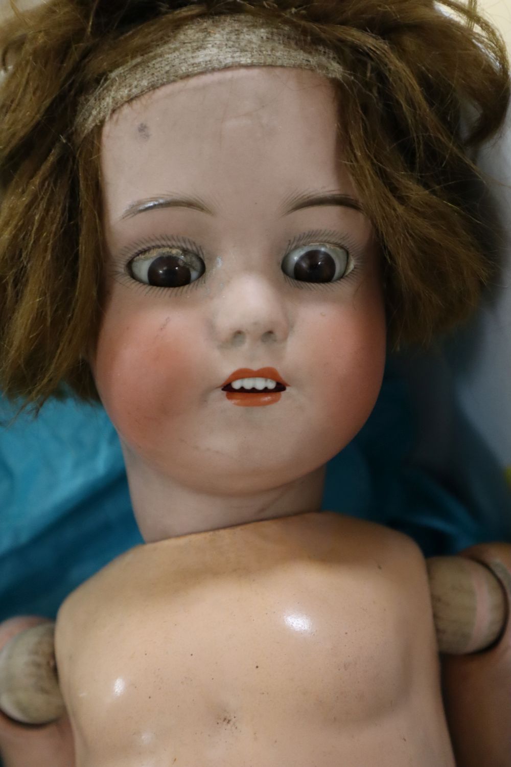 A Simon & Halbig bisque head jointed composition girl doll, H 22in and a jointed composition black doll (very a.f.)